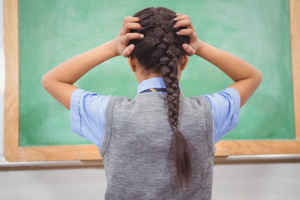 The girl is worried that she has lice